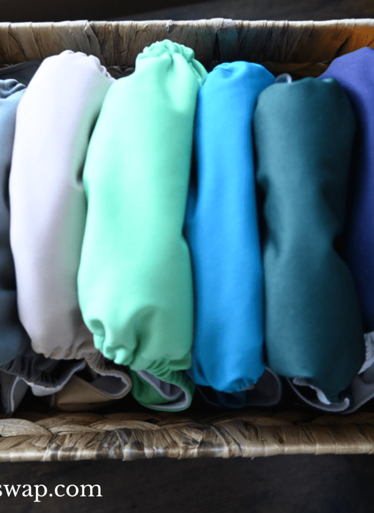 nora nursery alva baby cloth diapers in woven basket